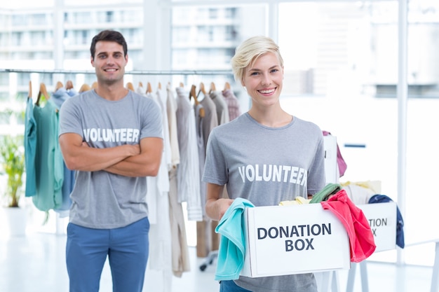 Blonde volunteer holding a donation box