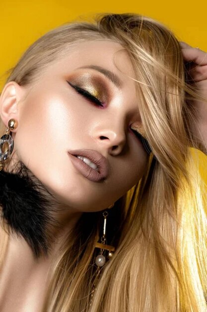 Blonde with great makeup Yellow background