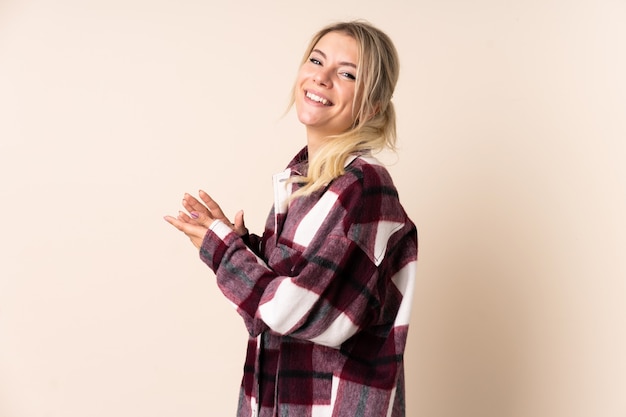 Blonde woman applauding