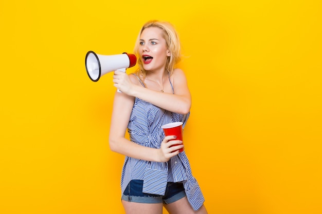 Blonde woman in blue striped blouse with megaphone