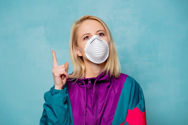 Blonde woman in face mask and 90s style clothes