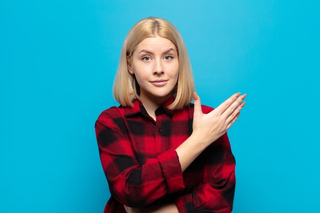 Blonde woman feeling confused and clueless, wondering about a doubtful explanation or thought