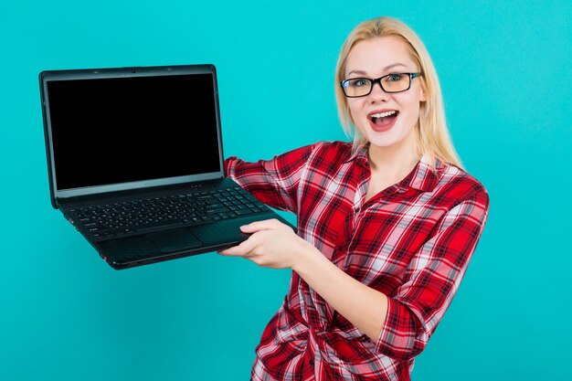 Blonde woman in glasses hold laptop