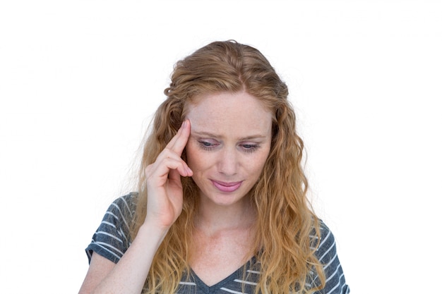 A blonde woman having headache