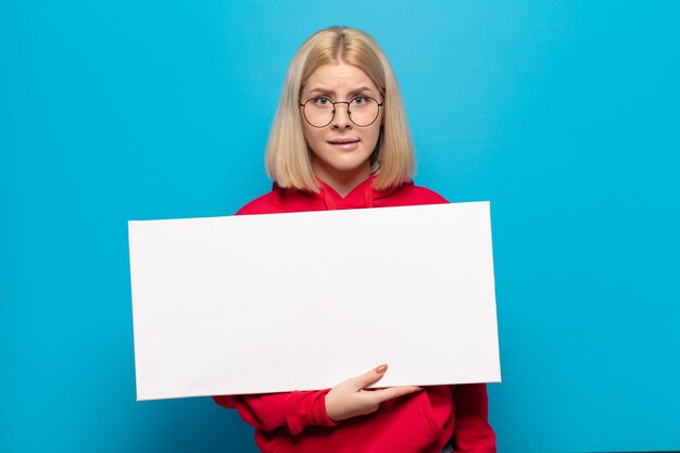 Blonde woman looking puzzled and confused