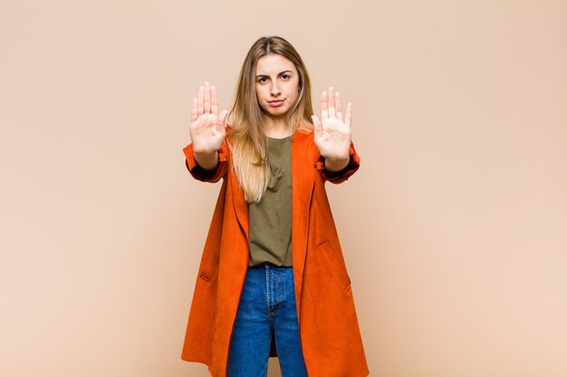 Blonde woman looking serious, unhappy