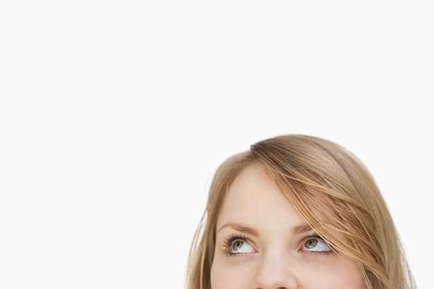 Blonde woman looking up