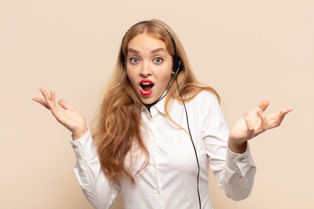 Blonde woman open-mouthed and amazed