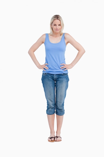 Blonde woman placing her hands on her hips