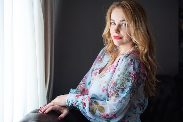 Blonde woman portrait in the summer dress