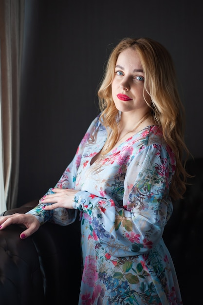 Blonde woman portrait in the summer dress