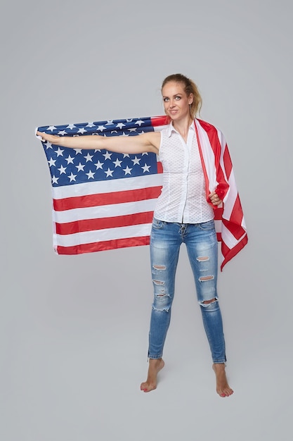 Blonde woman posing with usa flag white