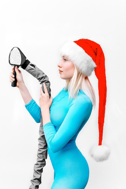 blonde woman in santa hat Cellulite treatment with LPG massage body and weight correction