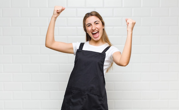 Blonde woman shouting triumphantly