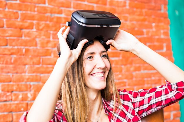 Blonde woman using the virtual reality headset