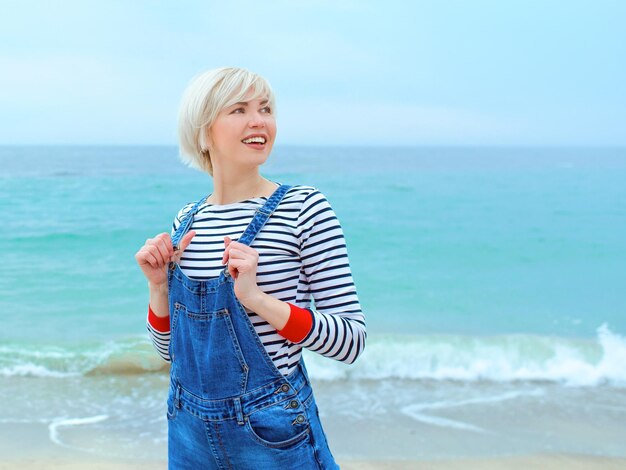 blonde woman on vacation by the sea