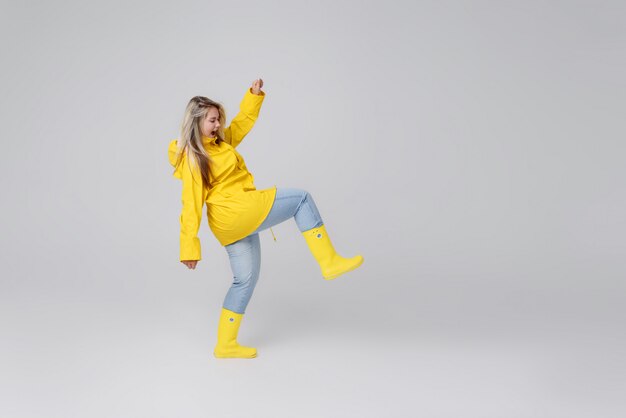 Blonde woman wearing yellow raincoat