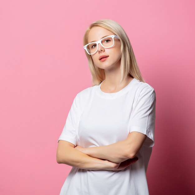 Blonde woman in white tshirt and glasses