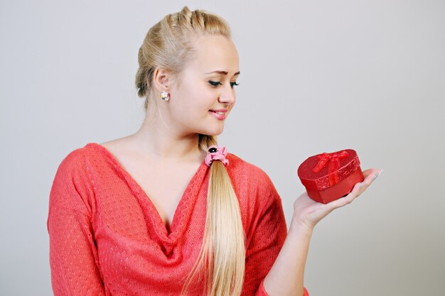 Blonde woman with a box of heart-shaped