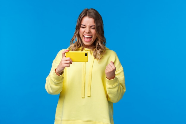 Blonde woman in a yellow sweatshirt