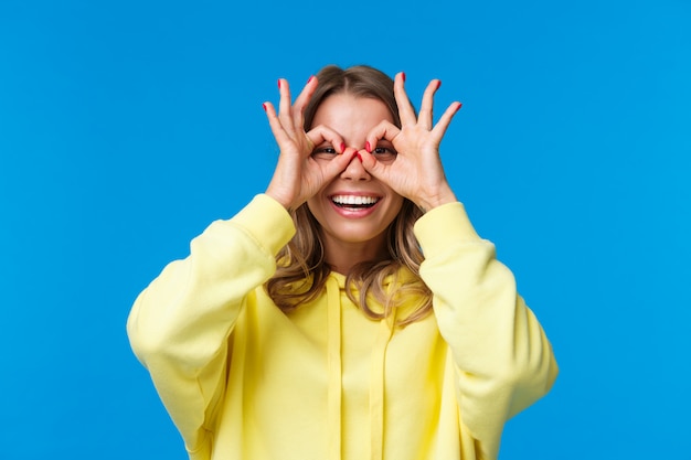 Blonde woman in a yellow sweatshirt