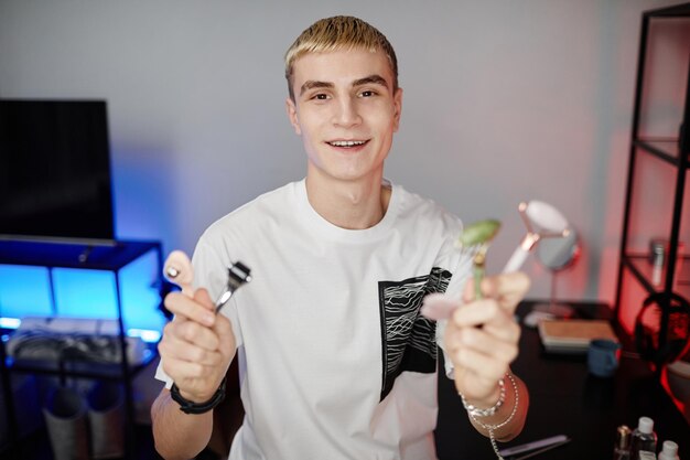 Blonde Young Man Filming Skincare Video