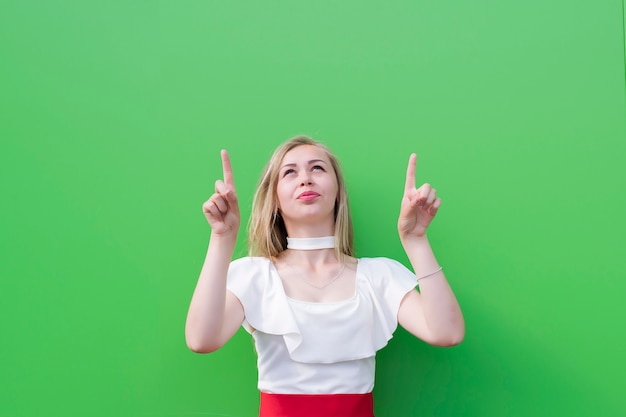 Blonde young woman presenting goods