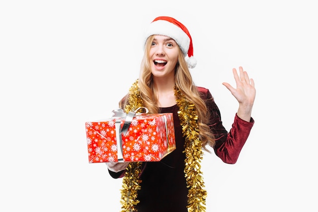 Blonde young woman wearing a Santa hat