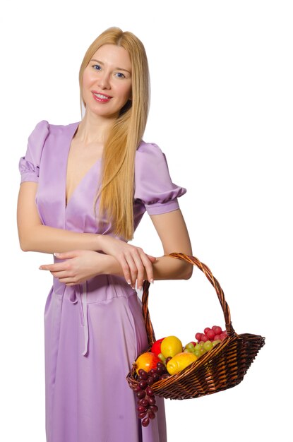 Blondie woman holding basket with fruits isolated