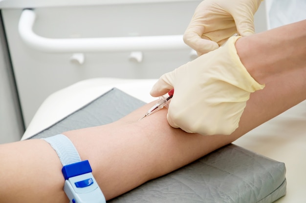 Blood collection using a syringe