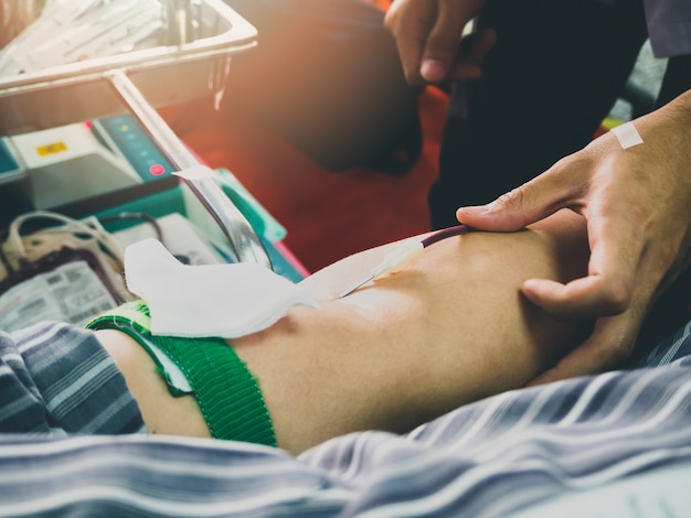 Blood Donor Making Donation In Hospital.