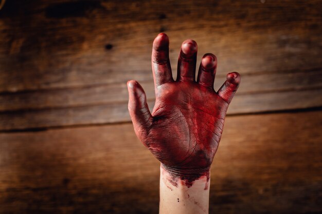 Blood on the hand with wooden 