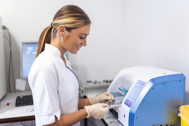 Blood hematology analyzer Close up of medical worker in lab