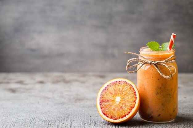 Blood orange smoothie with mint leaves