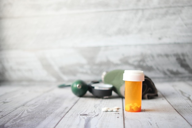 Blood pressure machine and medical pill container on table