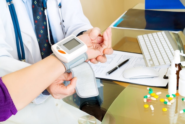 Photo blood pressure measuring by doctor