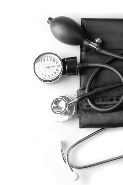 Blood pressure meter and stethoscope on white background