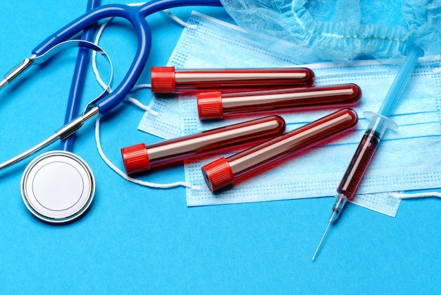 Blood sample in a test tube on a blue background