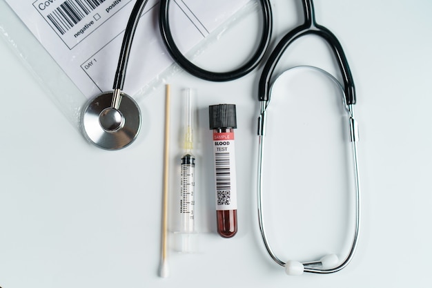 Blood test sample tube and stethoscope