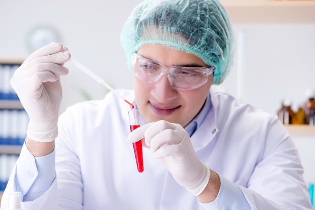 Photo blood testing in the lab with young scientist