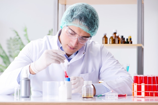 Blood testing in the lab with young scientist