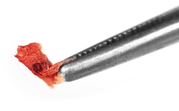 Blood in tissue paper with forceps