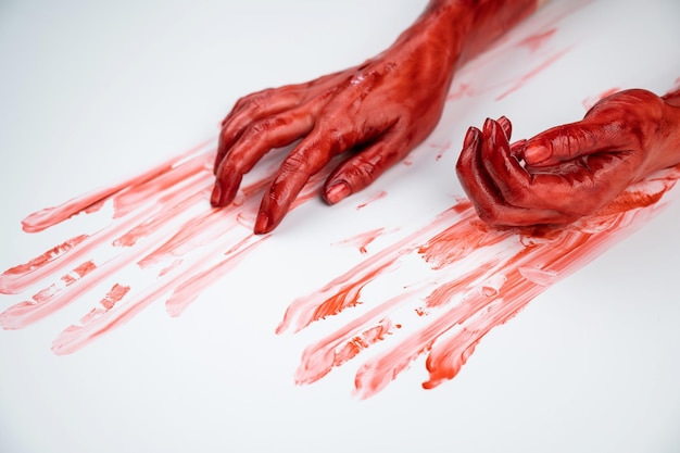 Photo bloody female hands on a white background