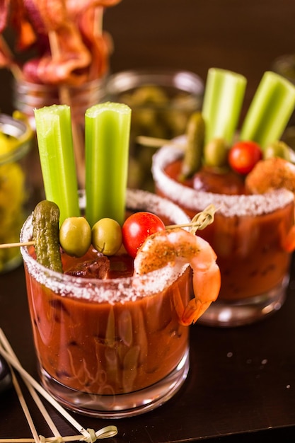 Bloody mary cocktail bar with variety of garnishes.