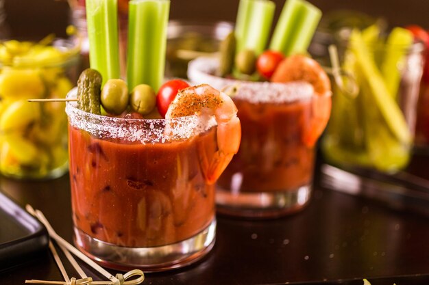 Bloody mary cocktail bar with variety of garnishes.