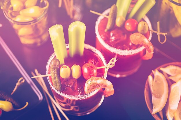 Bloody mary cocktail bar with variety of garnishes.