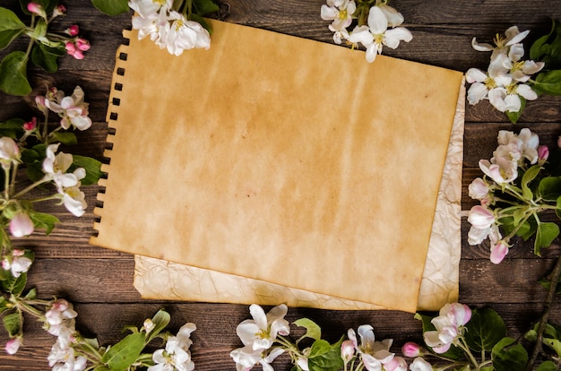 Blossoming apple tree on a wooden background, blank template