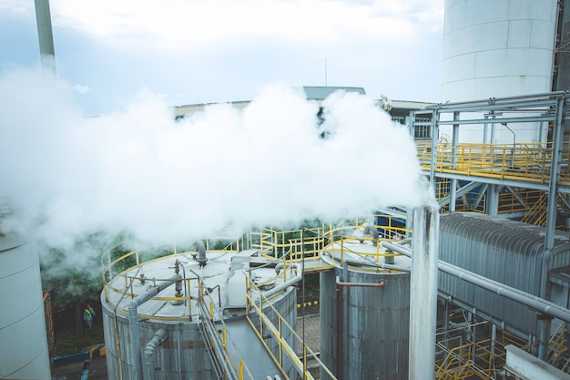 Blowing steam smoke  pipes line in crude oil factory, refinery plant, oil and gas plant during operation