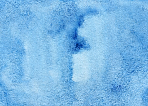 Blue abstract watercolor background on textured paper. Hand made watercolor backdrop