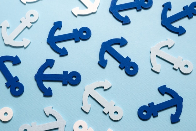 Blue anchors on a blue background.